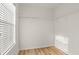 Walk-in closet with wood look floors, white walls and wire rack shelving at 1183 Honey Blossom Dr, Orlando, FL 32824