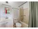 Cozy bathroom with vanity, toilet, bathtub, and shower at 1440 12Th St, Clermont, FL 34711