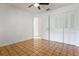 Cozy bedroom with tan tile flooring, a ceiling fan, and closet space at 1440 12Th St, Clermont, FL 34711