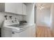 An interior view of a Laundry Room with a washer, dryer and storage at 1440 12Th St, Clermont, FL 34711