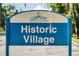 A sign reads Clermont Historic Village Choice of Champions at 1440 12Th St, Clermont, FL 34711