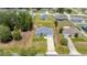 An aerial view of a charming one-story home, with property lines and neighborhood in view at 231 Marion Oaks Trl, Ocala, FL 34473