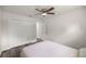 Comfortable bedroom with ceiling fan, closet, and modern flooring at 231 Marion Oaks Trl, Ocala, FL 34473