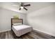 Neutral bedroom with a ceiling fan, one window letting in natural light, and modern flooring at 231 Marion Oaks Trl, Ocala, FL 34473