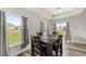 Bright dining room featuring a wooden table, seating for four, and plenty of natural light from large windows at 231 Marion Oaks Trl, Ocala, FL 34473