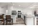 Modern kitchen with stainless steel appliances, granite countertops, and white cabinetry at 231 Marion Oaks Trl, Ocala, FL 34473