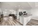 Open kitchen and living area featuring a kitchen island and stainless steel appliances at 231 Marion Oaks Trl, Ocala, FL 34473