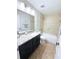 Bathroom featuring a granite countertop, a modern sink, and a tiled shower/tub at 663 Jamaica Cir, Lakeland, FL 33803