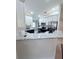 Modern kitchen with granite countertops, two-tone cabinets, and stainless steel appliances at 663 Jamaica Cir, Lakeland, FL 33803