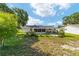 Spacious fenced backyard with patio and screened-in lanai at 8851 Sw 116Th Street Rd, Ocala, FL 34481