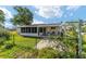 Backyard with screened-in porch provides green space and outdoor enjoyment at 8851 Sw 116Th Street Rd, Ocala, FL 34481