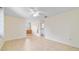 Bright bedroom with tile floor leading to a bathroom at 8851 Sw 116Th Street Rd, Ocala, FL 34481