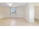Bright bedroom featuring a window and tile flooring at 8851 Sw 116Th Street Rd, Ocala, FL 34481