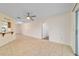 Dining room with tile flooring, a ceiling fan, and an opening to the kitchen at 8851 Sw 116Th Street Rd, Ocala, FL 34481