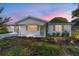 Charming home featuring a well-lit front yard and classic architectural design at 8851 Sw 116Th Street Rd, Ocala, FL 34481