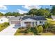 Beautiful home with lovely landscaping and a well-maintained front yard at 8851 Sw 116Th Street Rd, Ocala, FL 34481