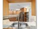 Kitchen pass-through shows granite countertops and stainless steel appliances at 8851 Sw 116Th Street Rd, Ocala, FL 34481