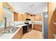 Charming kitchen features stainless appliances, granite counters, and ample cabinetry at 8851 Sw 116Th Street Rd, Ocala, FL 34481
