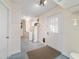 Utility area with washer, dryer, water heater, and access door to the exterior at 8851 Sw 116Th Street Rd, Ocala, FL 34481