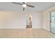 Spacious living room features neutral paint, tile floors, and a door to the lanai at 8851 Sw 116Th Street Rd, Ocala, FL 34481