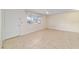 Bright living area featuring a ceiling fan, neutral paint, and large windows at 8851 Sw 116Th Street Rd, Ocala, FL 34481