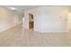 Bright and open living area featuring tile floors and a pass-through to the kitchen at 8851 Sw 116Th Street Rd, Ocala, FL 34481