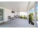 Outdoor patio with seating and a view of the backyard at 8851 Sw 116Th Street Rd, Ocala, FL 34481