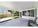 Covered patio area with views of the backyard and surrounding landscape at 8851 Sw 116Th Street Rd, Ocala, FL 34481