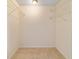 Walk-in closet with hanging metal racks at 8851 Sw 116Th Street Rd, Ocala, FL 34481