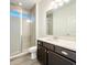 Bathroom featuring a glass-enclosed shower, wood cabinets, and a spacious vanity with a sink at 1138 Fountain Coin Loop, Orlando, FL 32828
