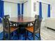 Cozy dining area with a round table, six chairs, and lots of natural light at 1138 Fountain Coin Loop, Orlando, FL 32828