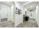 Inviting entryway with wood-look tile floors, decorative moldings, and a view of the front door at 1138 Fountain Coin Loop, Orlando, FL 32828