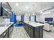 Modern kitchen with granite countertops, stainless steel appliances, dark wood cabinets, and an eat-in island at 1138 Fountain Coin Loop, Orlando, FL 32828