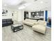 Bright open-concept living space with tile floors, recessed lighting, and views of the kitchen at 1138 Fountain Coin Loop, Orlando, FL 32828