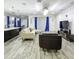 Spacious living room featuring neutral tones, wood-look tile, recessed lighting, and an open layout at 1138 Fountain Coin Loop, Orlando, FL 32828