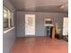 The home features an enclosed carport with brick walls and a white door at 119 Allen Ave, Winter Haven, FL 33880