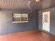 The home features an enclosed carport with brick walls and a white door at 119 Allen Ave, Winter Haven, FL 33880