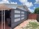 The side of the home features a red brick area near a carport at 119 Allen Ave, Winter Haven, FL 33880