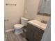 Well-lit bathroom with new vanity, a modern mirror, and updated toilet at 1514 Crest Ave, Leesburg, FL 34748