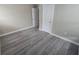 Inviting bedroom featuring freshly painted walls, modern flooring and ample sunlight at 1514 Crest Ave, Leesburg, FL 34748