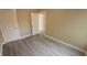 Cozy bedroom featuring fresh paint, new flooring, and ample closet space at 1514 Crest Ave, Leesburg, FL 34748