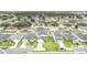 Overhead view of neighborhood featuring lush lawns, landscaping, and spacious driveways at 1518 Louise Ave, Auburndale, FL 33823