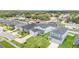 Neighborhood aerial view, showcasing the homes and lush green lawns and landscaping at 1518 Louise Ave, Auburndale, FL 33823