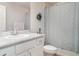 Cozy bathroom featuring a vanity, mirror, toilet, and shower with a curtain at 1518 Louise Ave, Auburndale, FL 33823