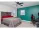 Stylish bedroom with a unique wooden headboard and accent wall, illuminated by a ceiling fan at 1518 Louise Ave, Auburndale, FL 33823