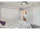 Cozy bedroom featuring patterned bedding, ample closet space, and a serene atmosphere for restful nights at 1518 Louise Ave, Auburndale, FL 33823