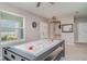 Spacious game room featuring an air hockey table, with view to front door at 1518 Louise Ave, Auburndale, FL 33823