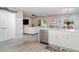 Open floor plan showcasing the kitchen that features stone countertops, a dining area, and living room at 1518 Louise Ave, Auburndale, FL 33823