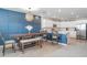 Bright kitchen with white cabinetry, stone countertops, and views of dining area at 1518 Louise Ave, Auburndale, FL 33823