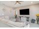 Comfortable living room with a large TV, a sectional sofa, and neutral-toned walls at 1518 Louise Ave, Auburndale, FL 33823